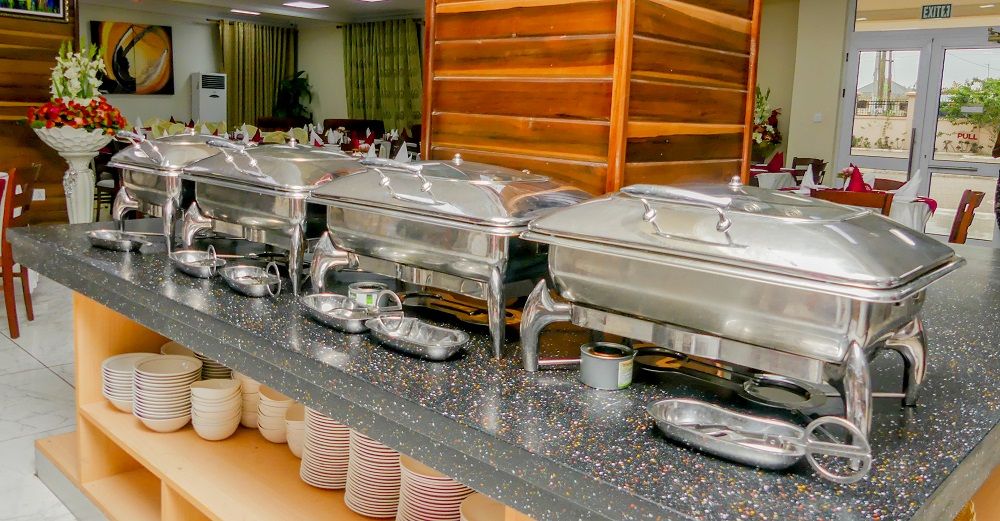 Breakfast buffet with chafing dishes and fresh bread
